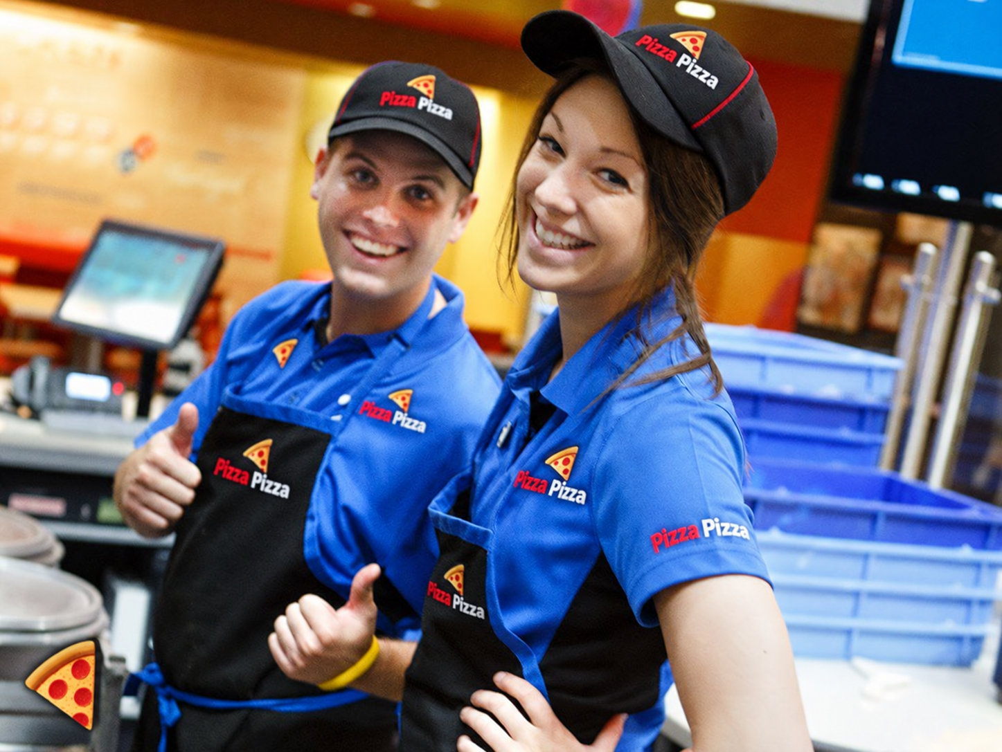 Pizza Pizza staff wearing branded caps, shirts and aprons
